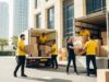 Professional movers in Business Bay loading boxes into a truck outside a high-rise building in Business Bay, Dubai, representing trusted local movers in the area.